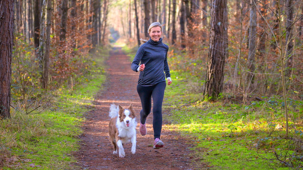 Why having pets at home could change your life; woman running with dog